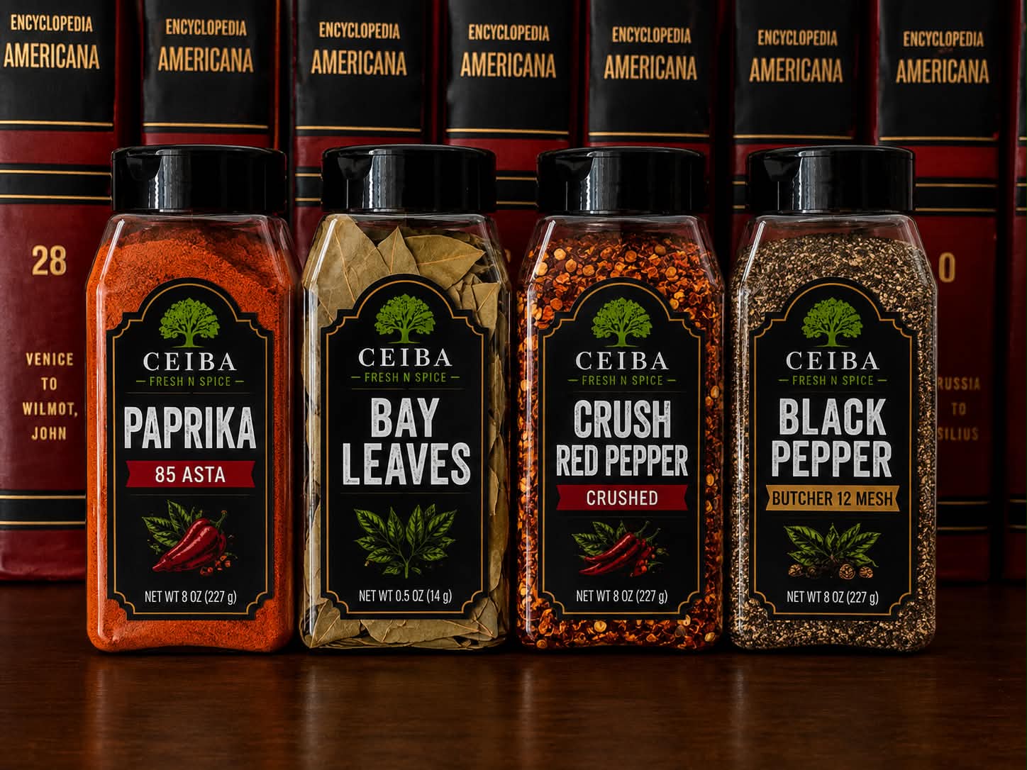 The Ceiba Fresh N Spice lineup: paprika, bay leaves, crushed red pepper, and black pepper jars