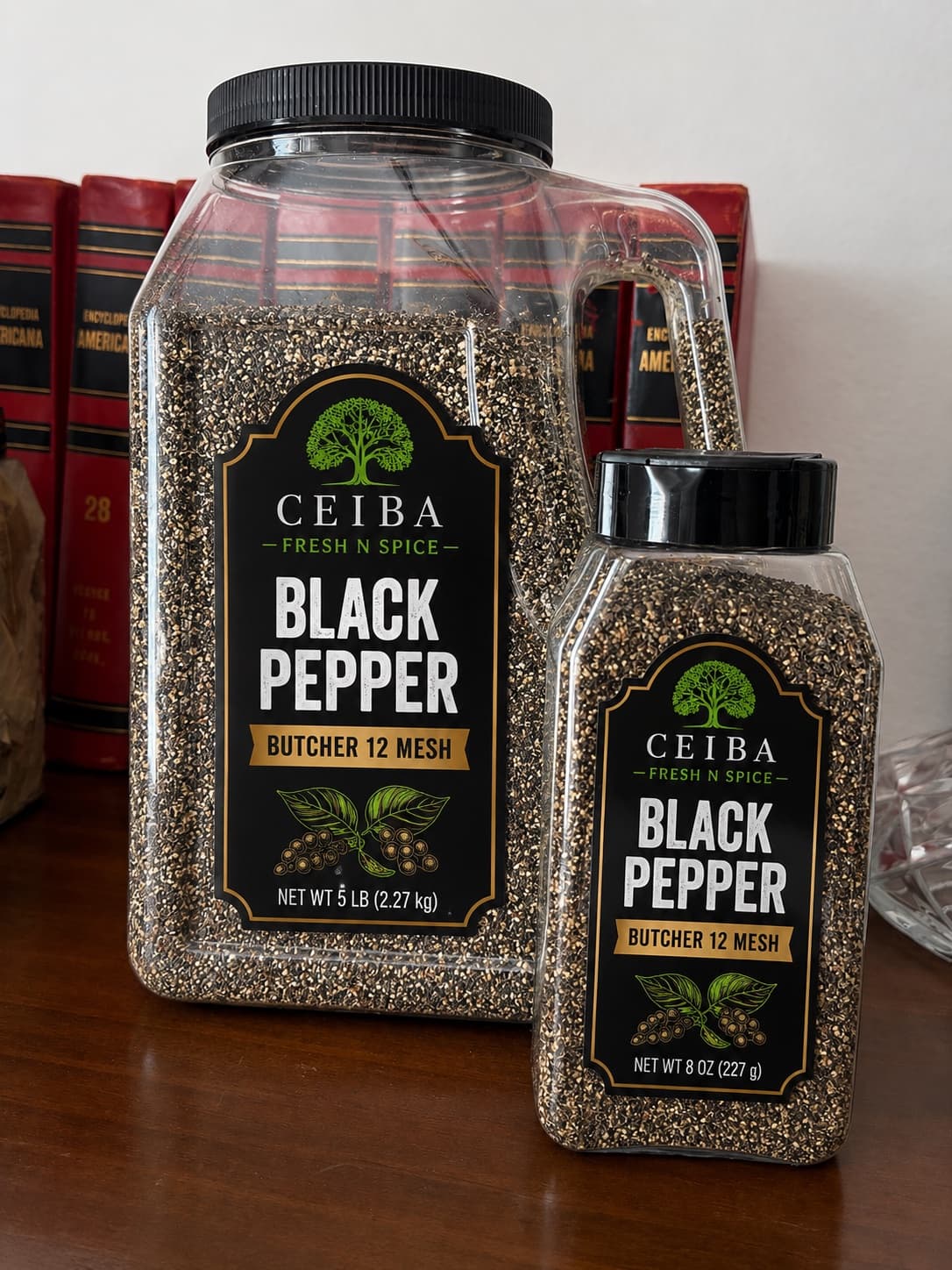 Ceiba black pepper in an 8 oz jar next to the 5 lb foodservice jug